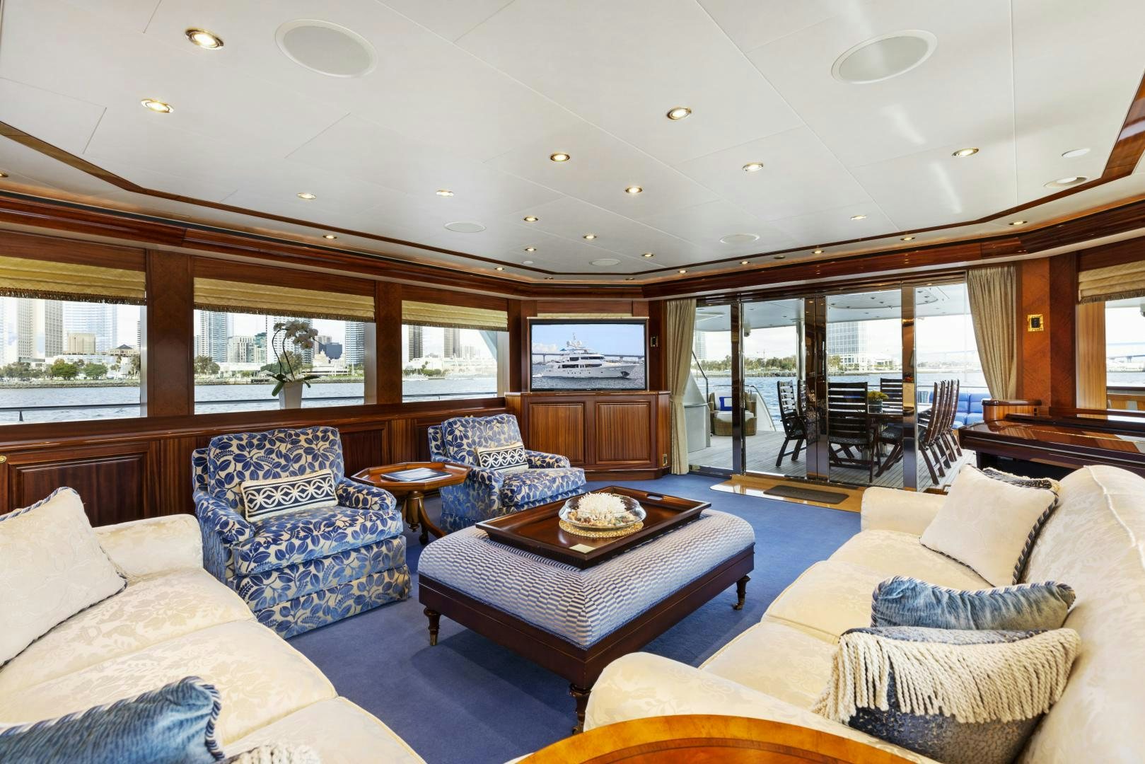a living room with a large glass window aboard APHRODITE Yacht for Sale