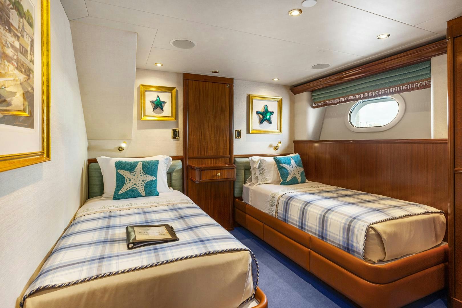 a couple of beds in a room aboard APHRODITE Yacht for Sale