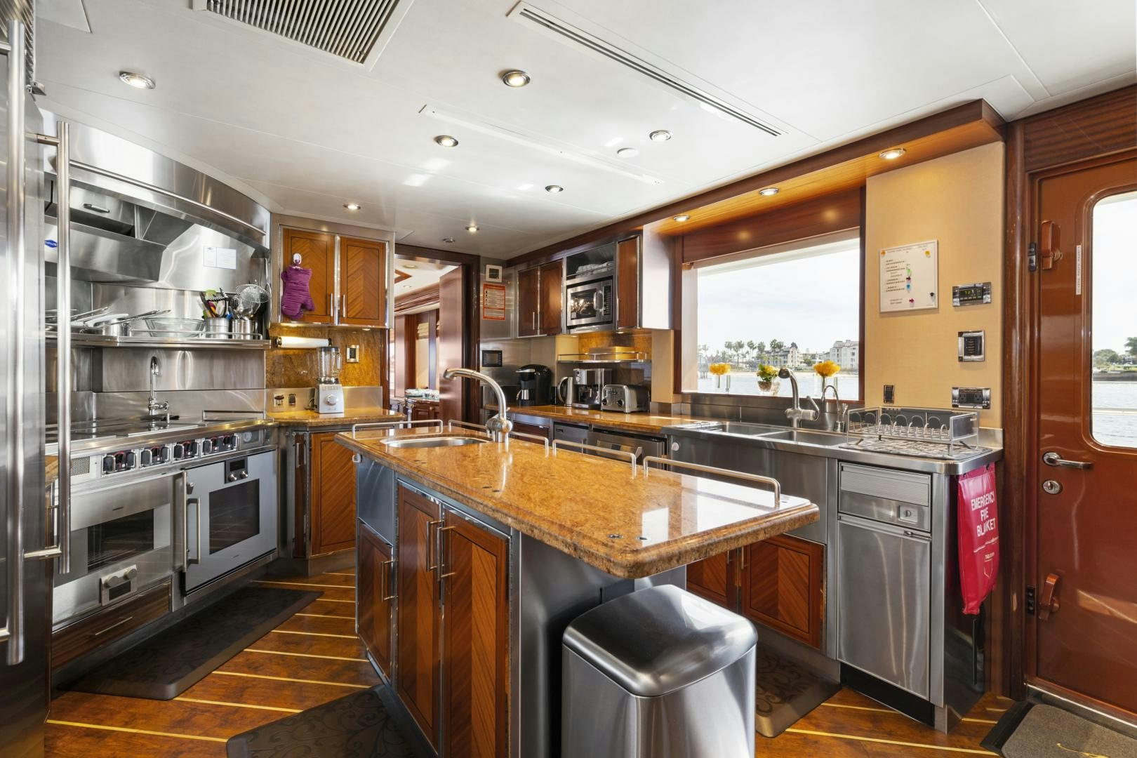 a kitchen with a stainless steel sink aboard APHRODITE Yacht for Sale