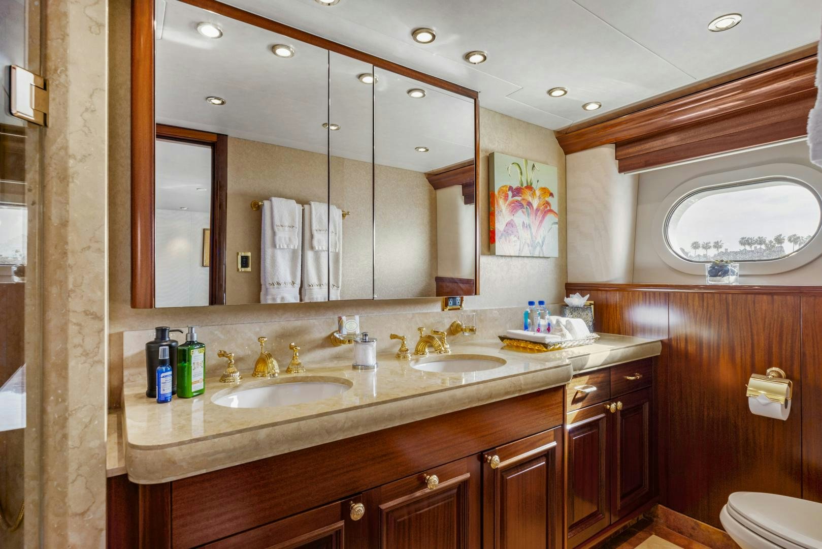 a bathroom with a large mirror aboard APHRODITE Yacht for Sale