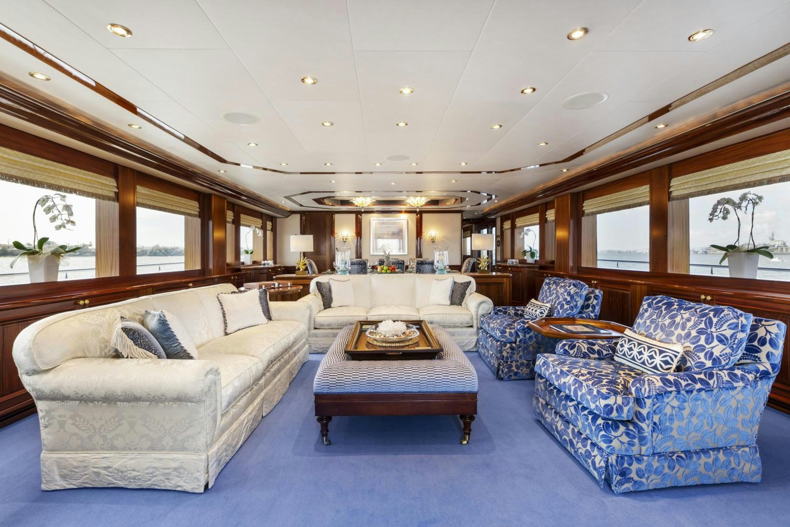 a living room with couches and a coffee table aboard APHRODITE Yacht for Sale