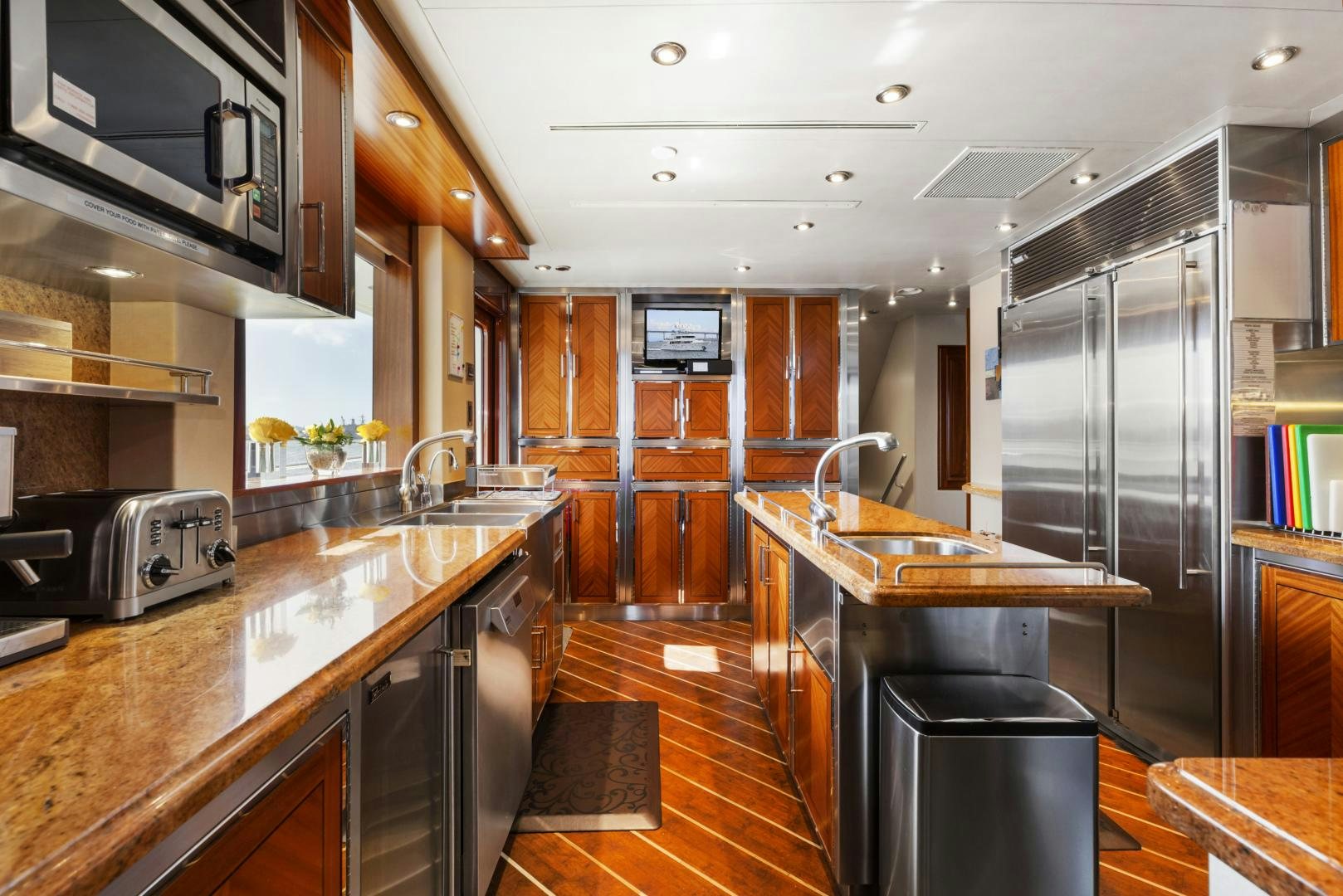 a kitchen with stainless steel appliances aboard APHRODITE Yacht for Sale