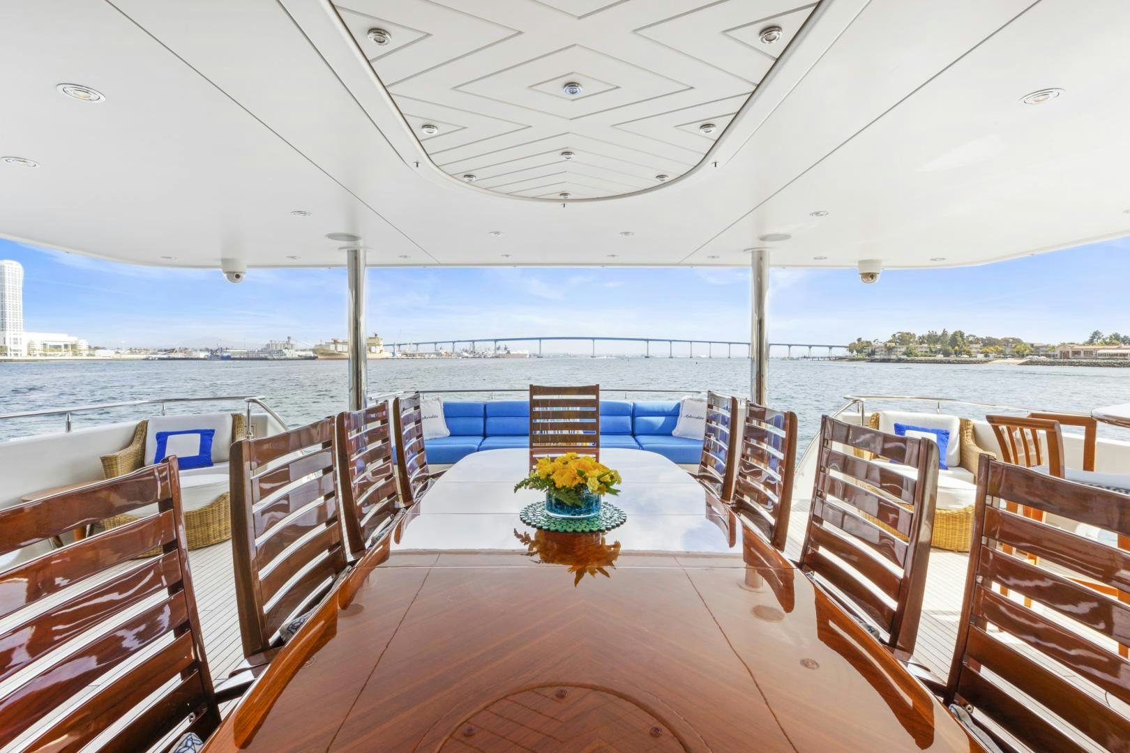 a deck with chairs and tables on it aboard APHRODITE Yacht for Sale