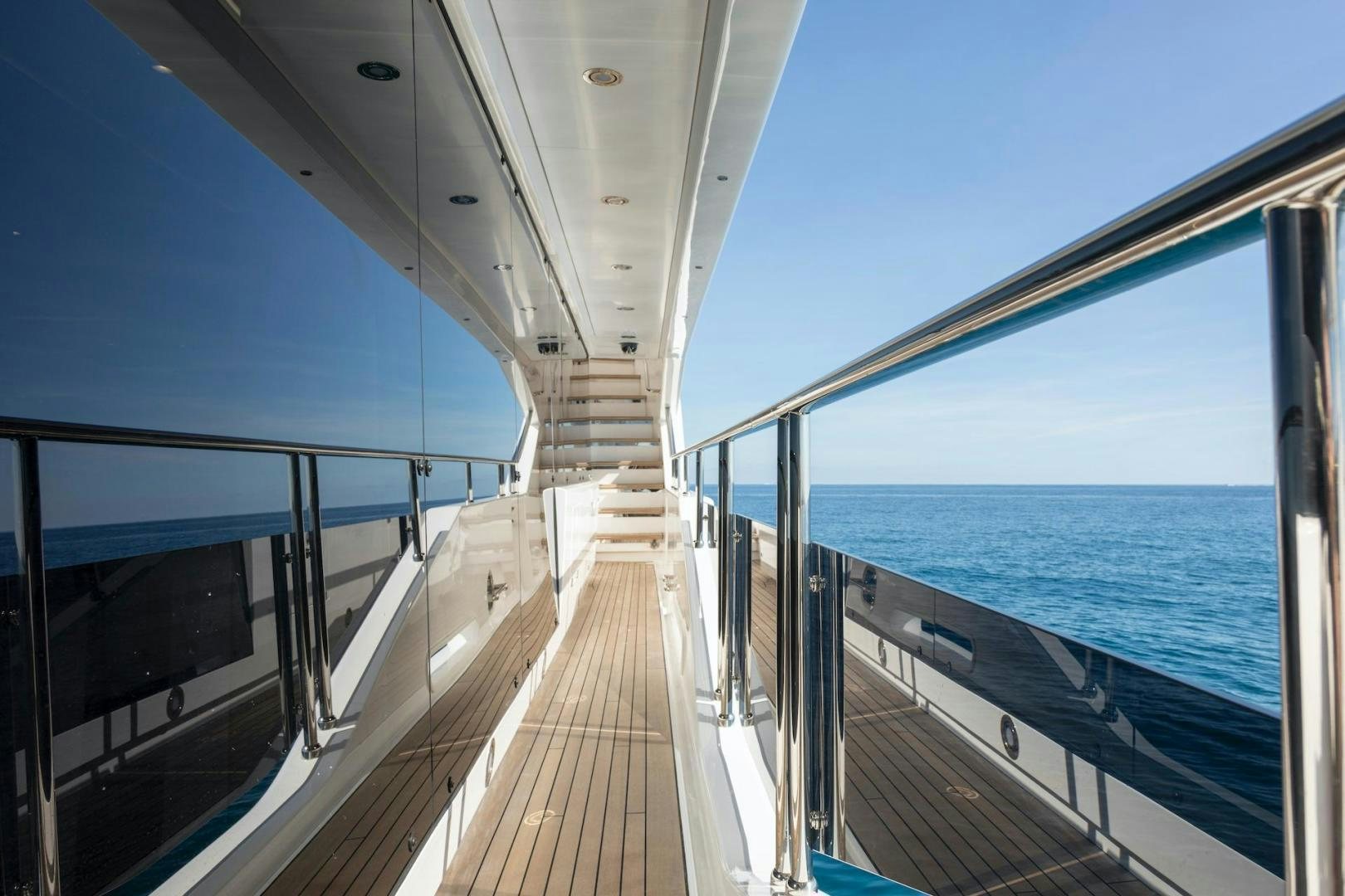 a wooden walkway over water aboard EXODUS Yacht for Sale
