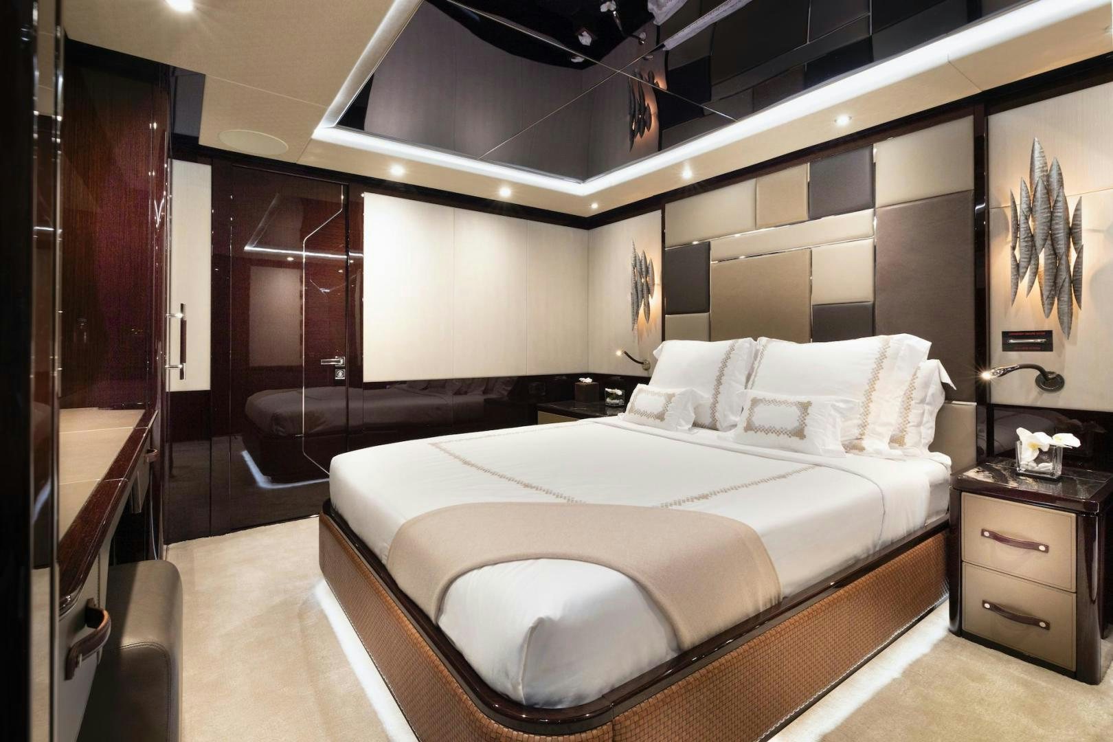 a large bedroom with a large bed aboard EXODUS Yacht for Sale
