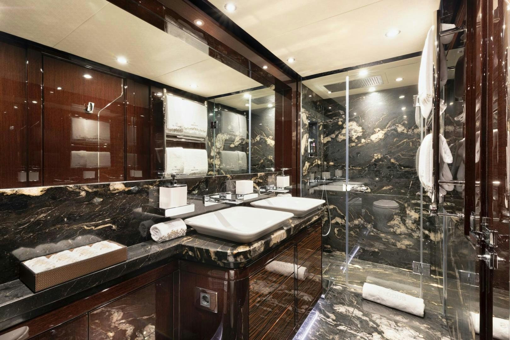 a bathroom with a large mirror aboard EXODUS Yacht for Sale