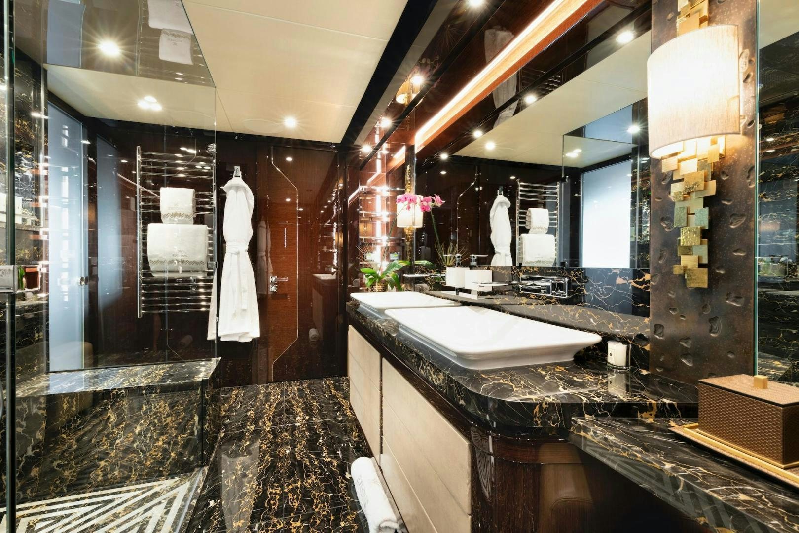 a bathroom with a large marble countertop aboard EXODUS Yacht for Sale