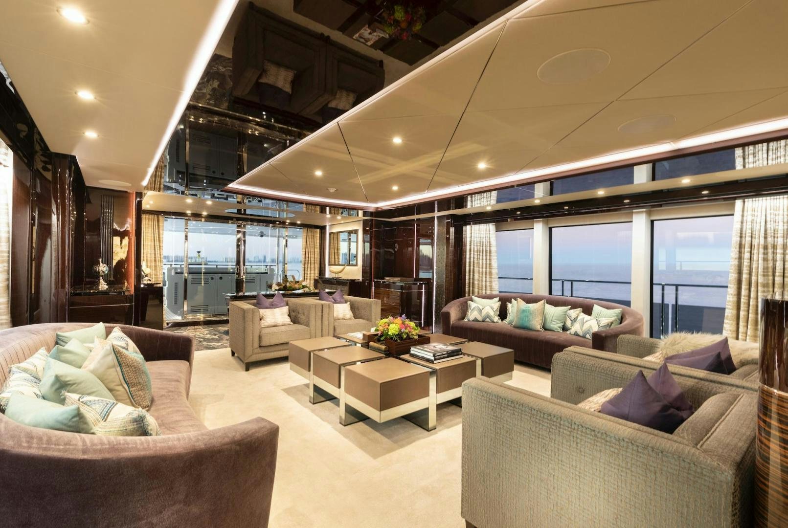 a living room with a large window aboard EXODUS Yacht for Sale
