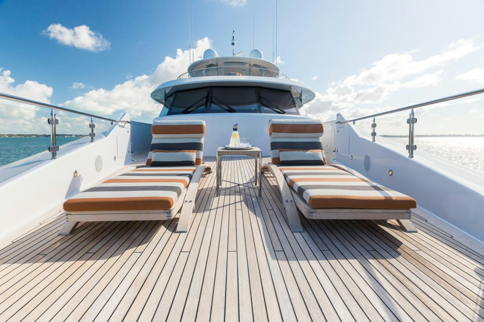 a deck with a boat on it aboard ARMS REACH Yacht for Sale