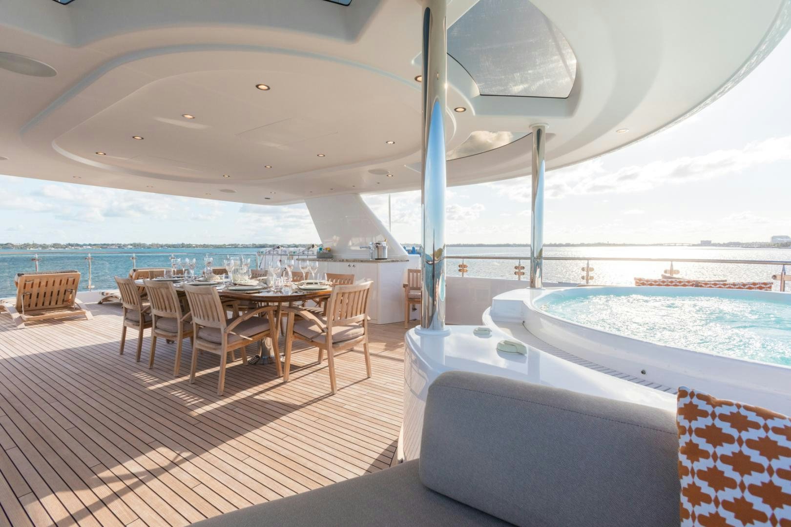 a large pool with a deck and chairs and a large pool aboard ARMS REACH Yacht for Sale