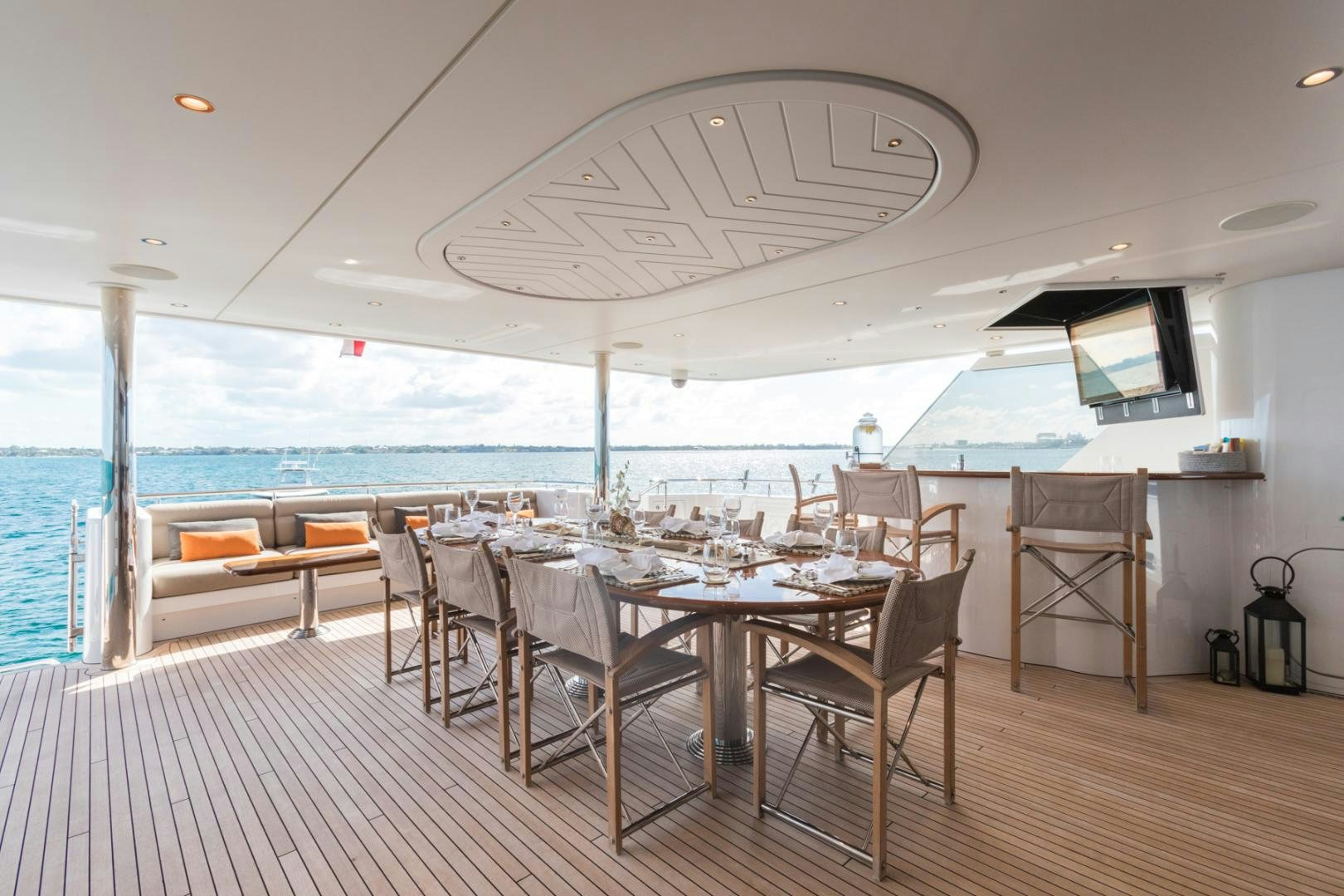 a dining room with a large table and chairs aboard ARMS REACH Yacht for Sale