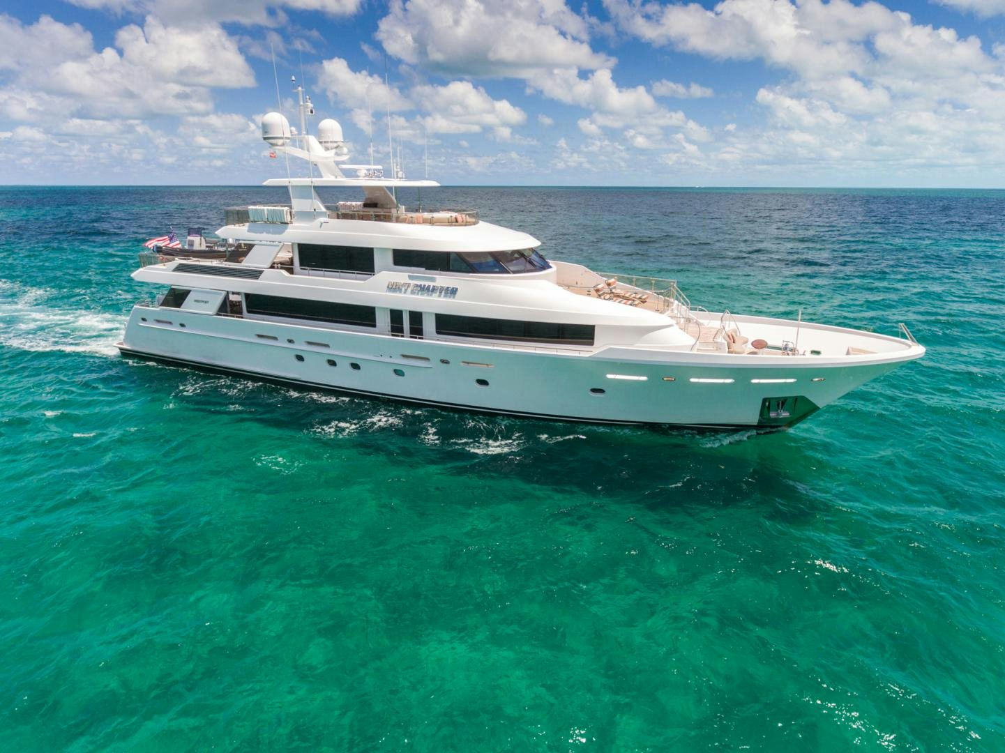 a white yacht in the water aboard ARMS REACH Yacht for Sale