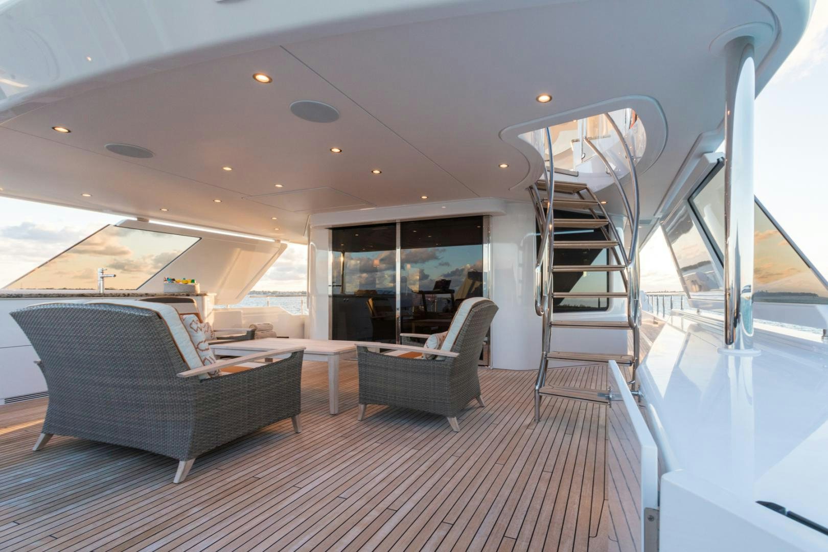 a living room with a staircase aboard ARMS REACH Yacht for Sale