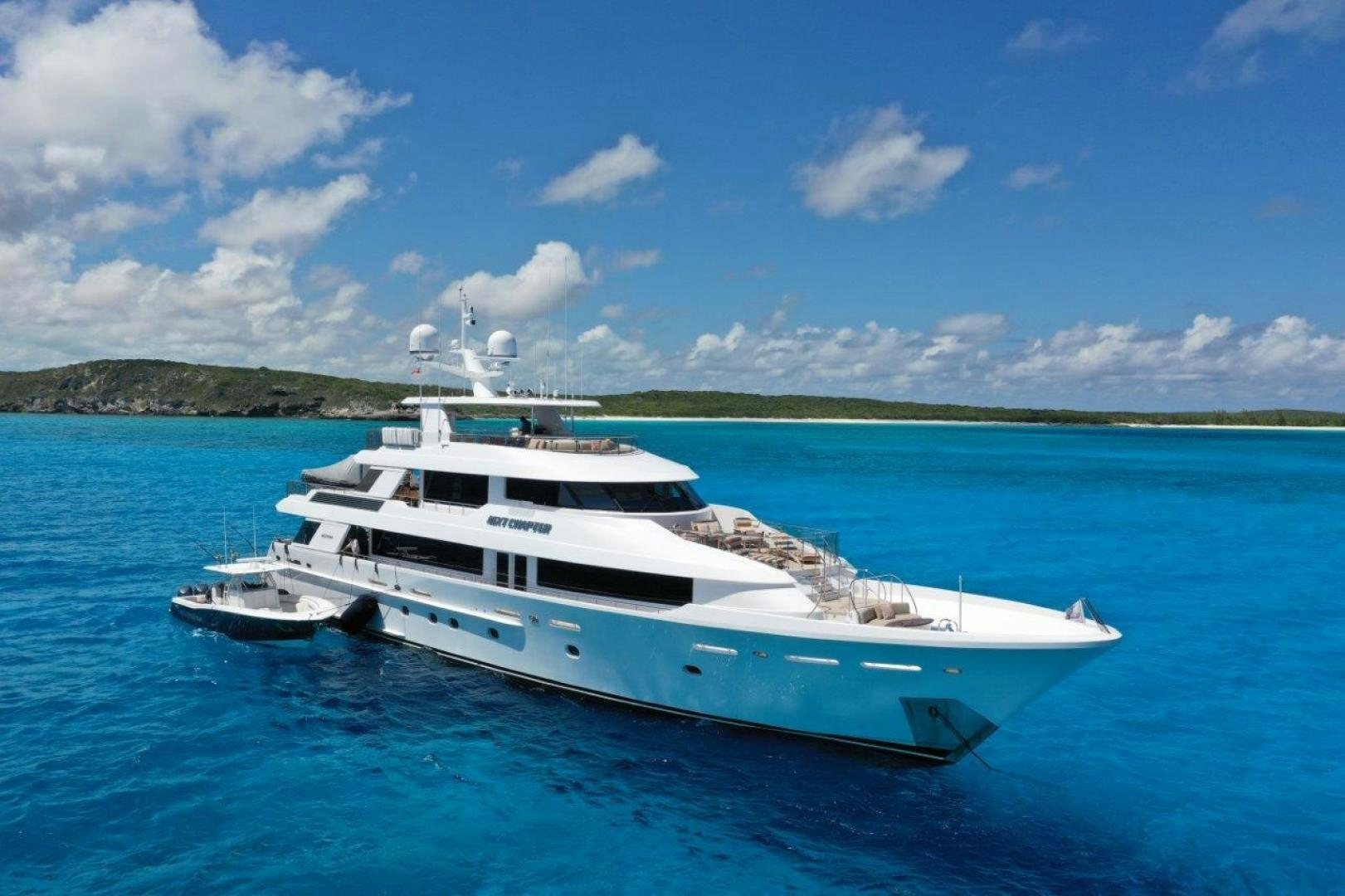 a white yacht in the water aboard ARMS REACH Yacht for Sale