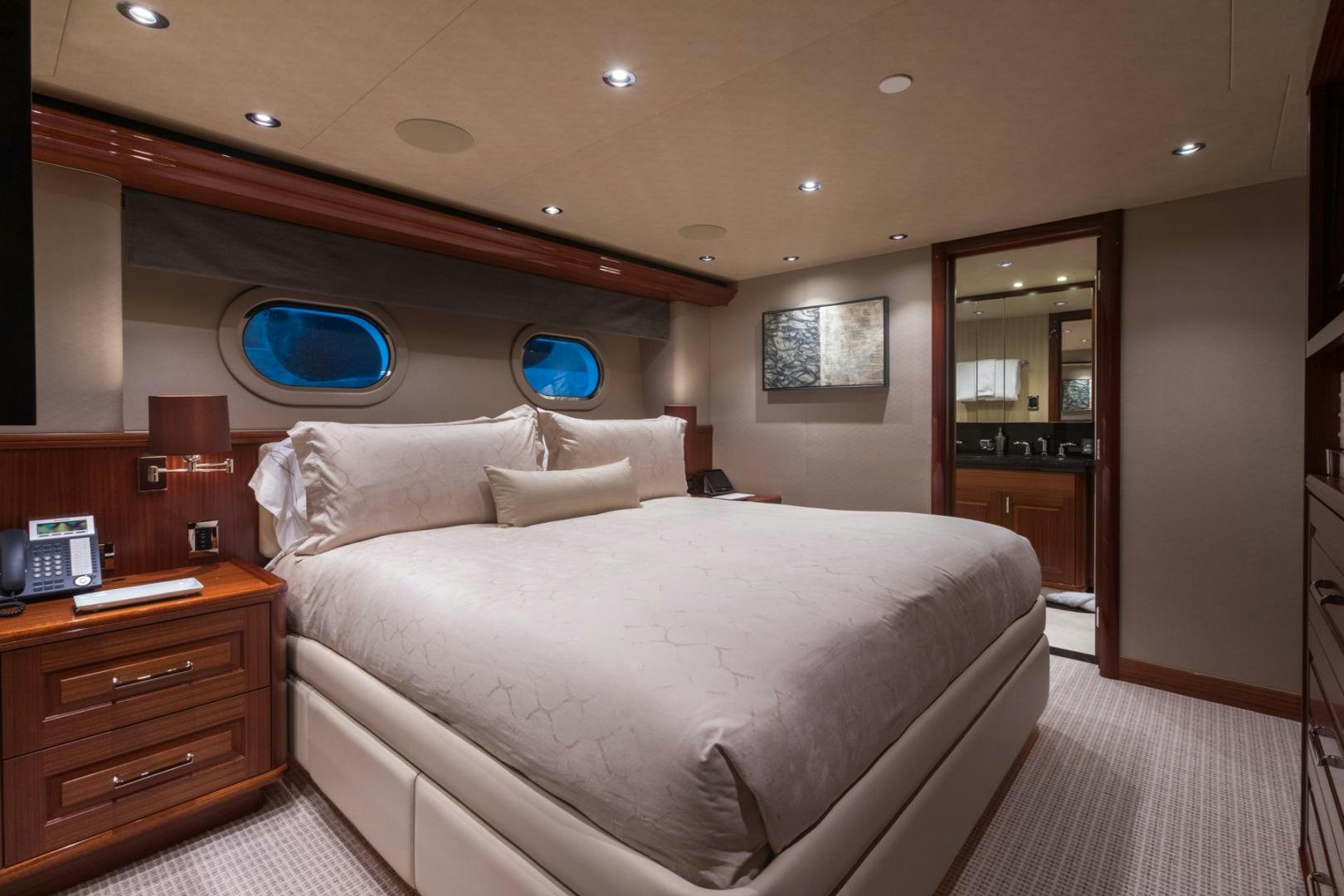 a large bed in a hotel room aboard ARMS REACH Yacht for Sale