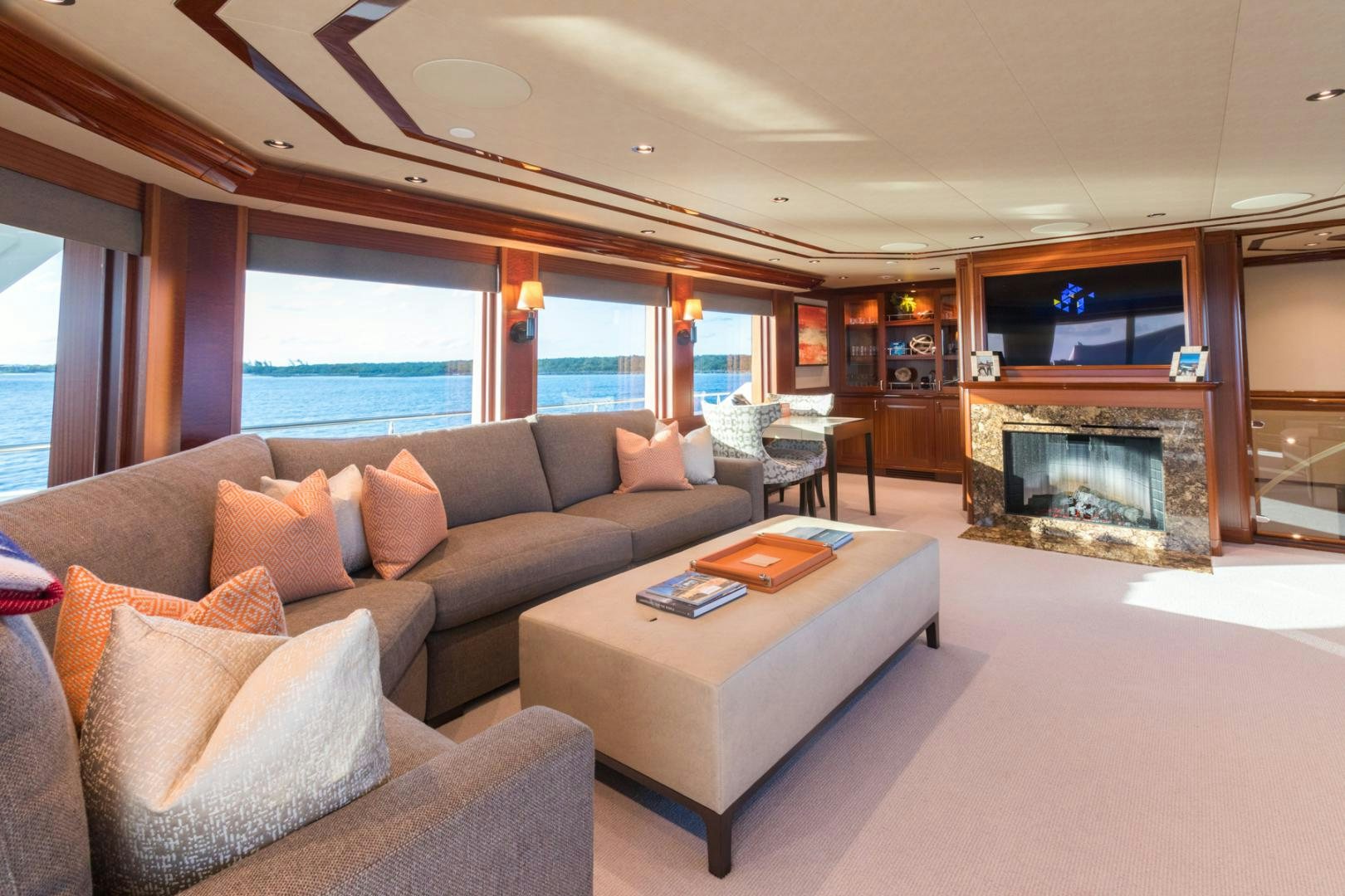 a living room with a fireplace aboard ARMS REACH Yacht for Sale