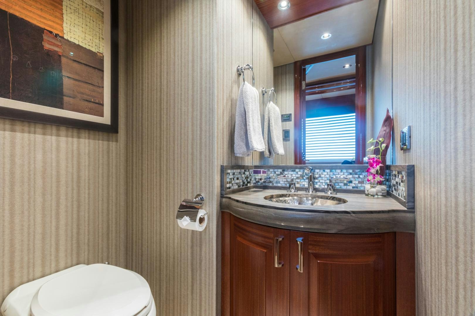 a bathroom with a sink and a mirror aboard ARMS REACH Yacht for Sale