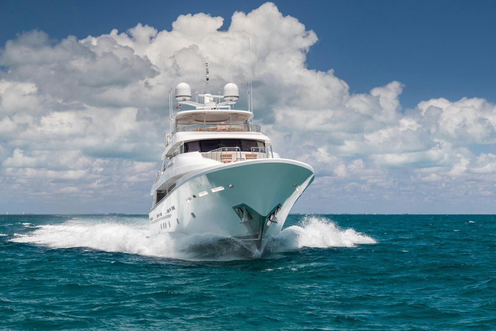 a white boat on the water aboard ARMS REACH Yacht for Sale