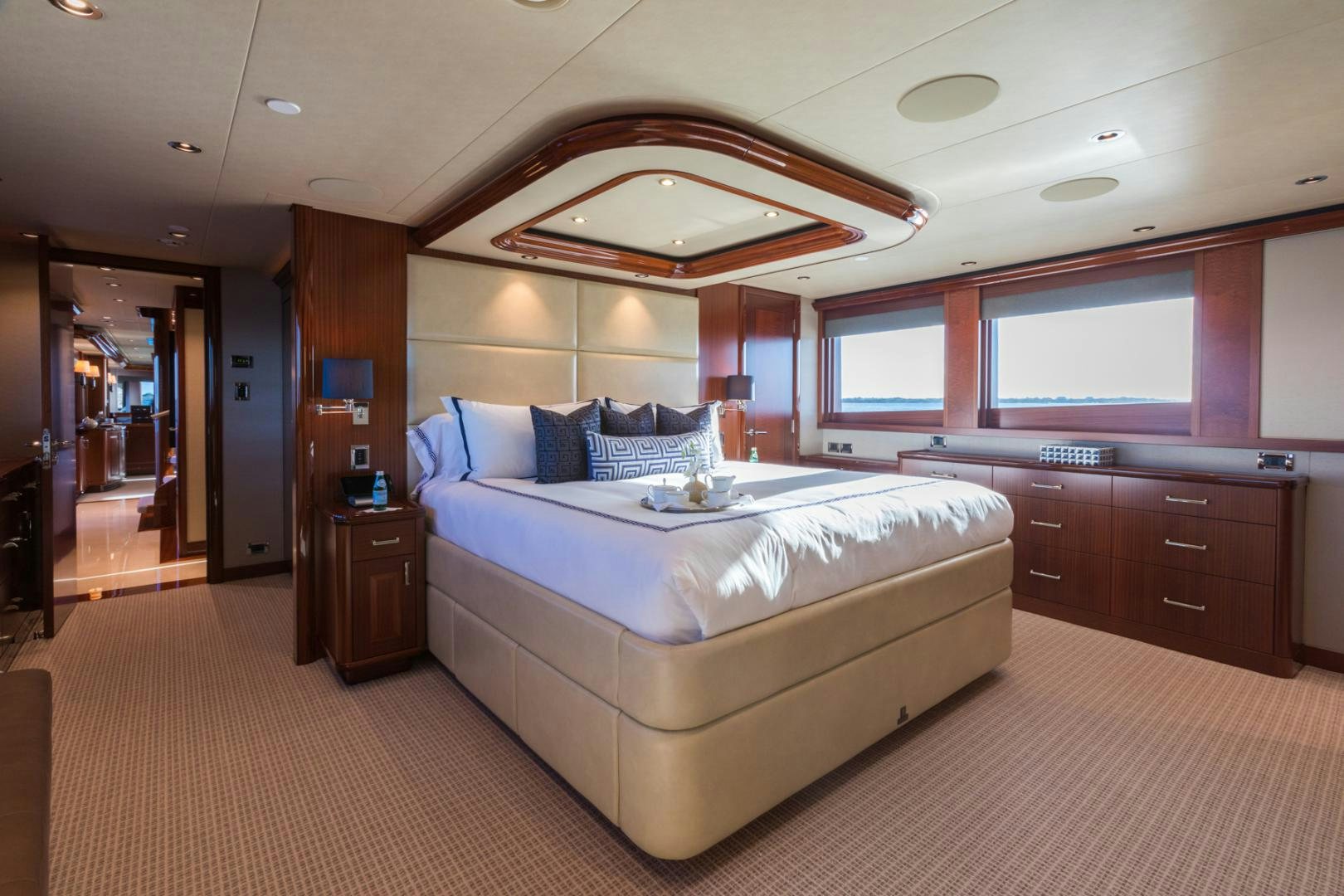 a large bedroom with a large bed aboard ARMS REACH Yacht for Sale