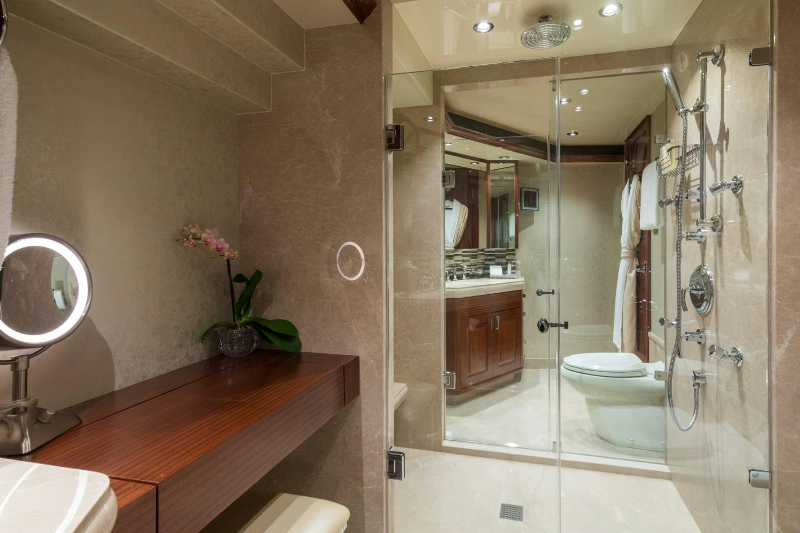 a bathroom with a glass shower aboard ARMS REACH Yacht for Sale