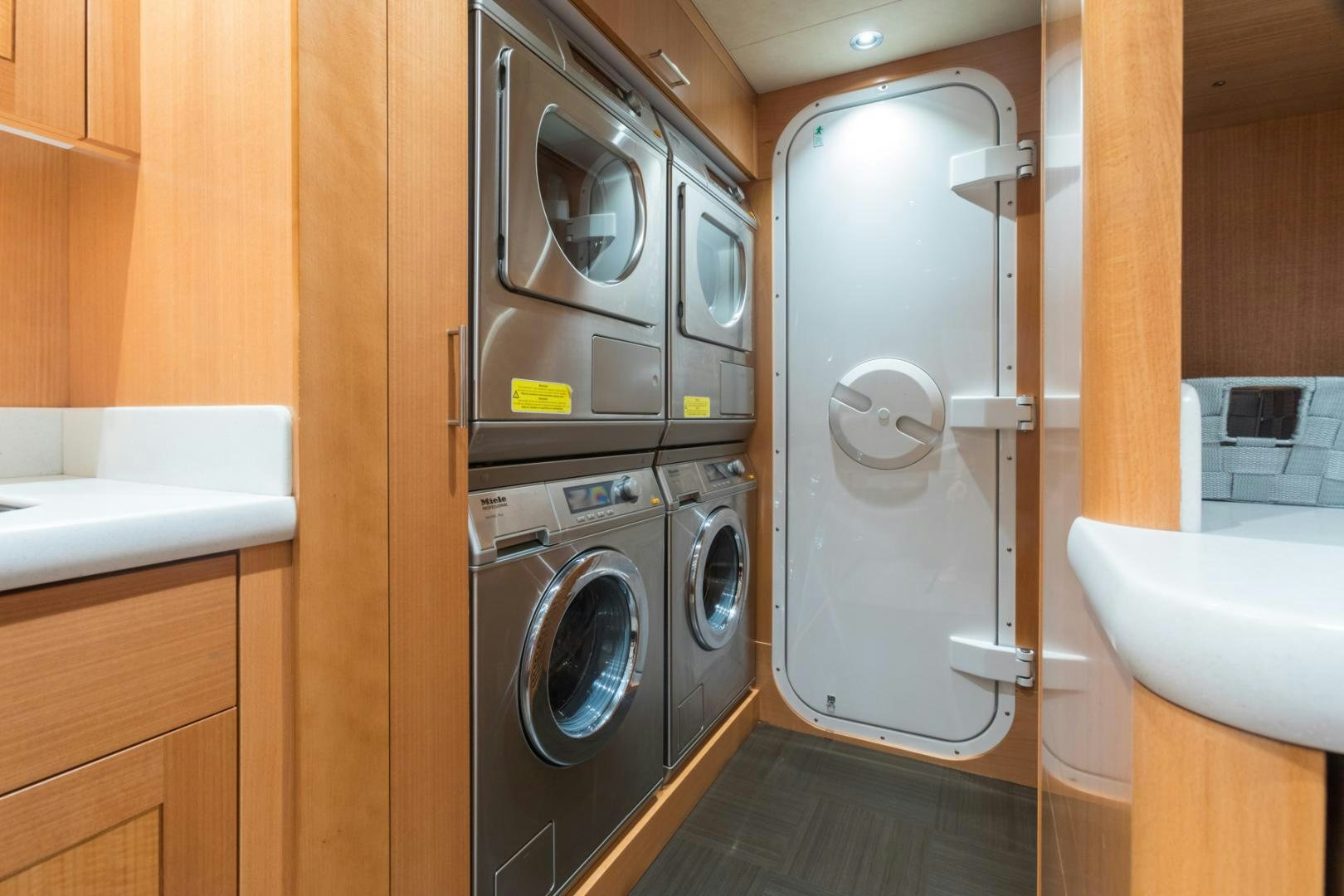 a washer and dryer in a room aboard ARMS REACH Yacht for Sale