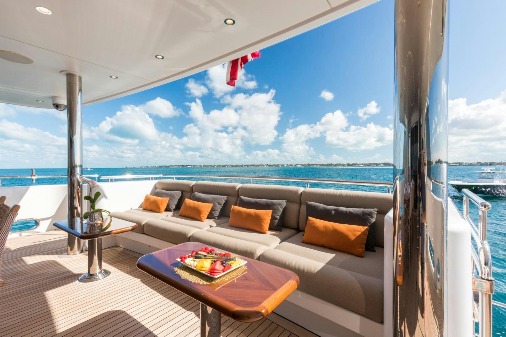 a large living room with a large ocean view aboard ARMS REACH Yacht for Sale