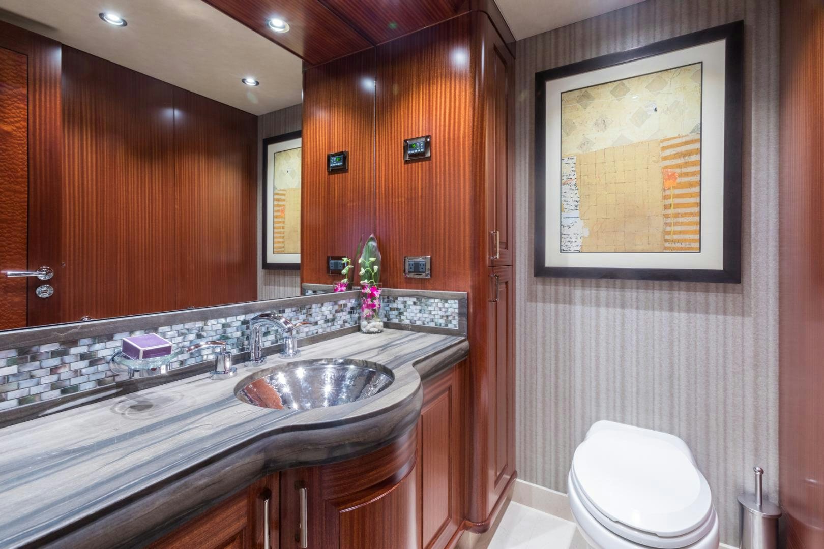 a bathroom with a sink and a toilet aboard ARMS REACH Yacht for Sale