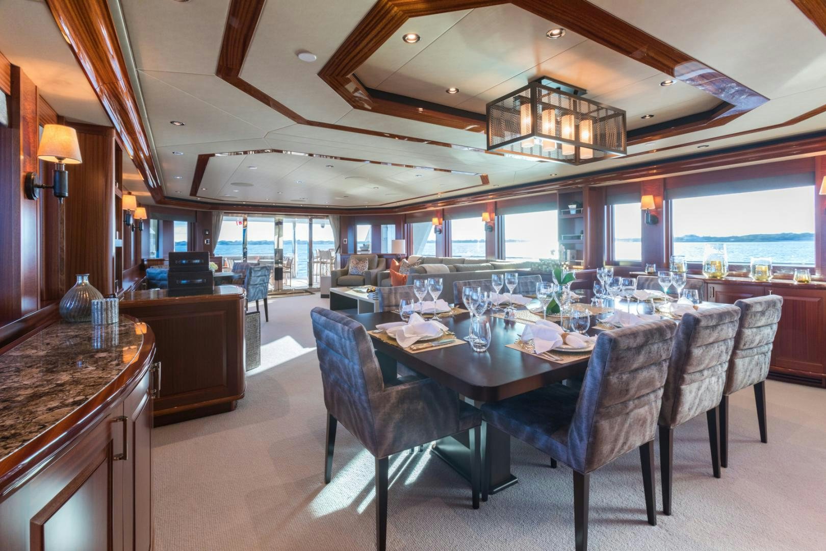 a large kitchen with a dining table aboard ARMS REACH Yacht for Sale