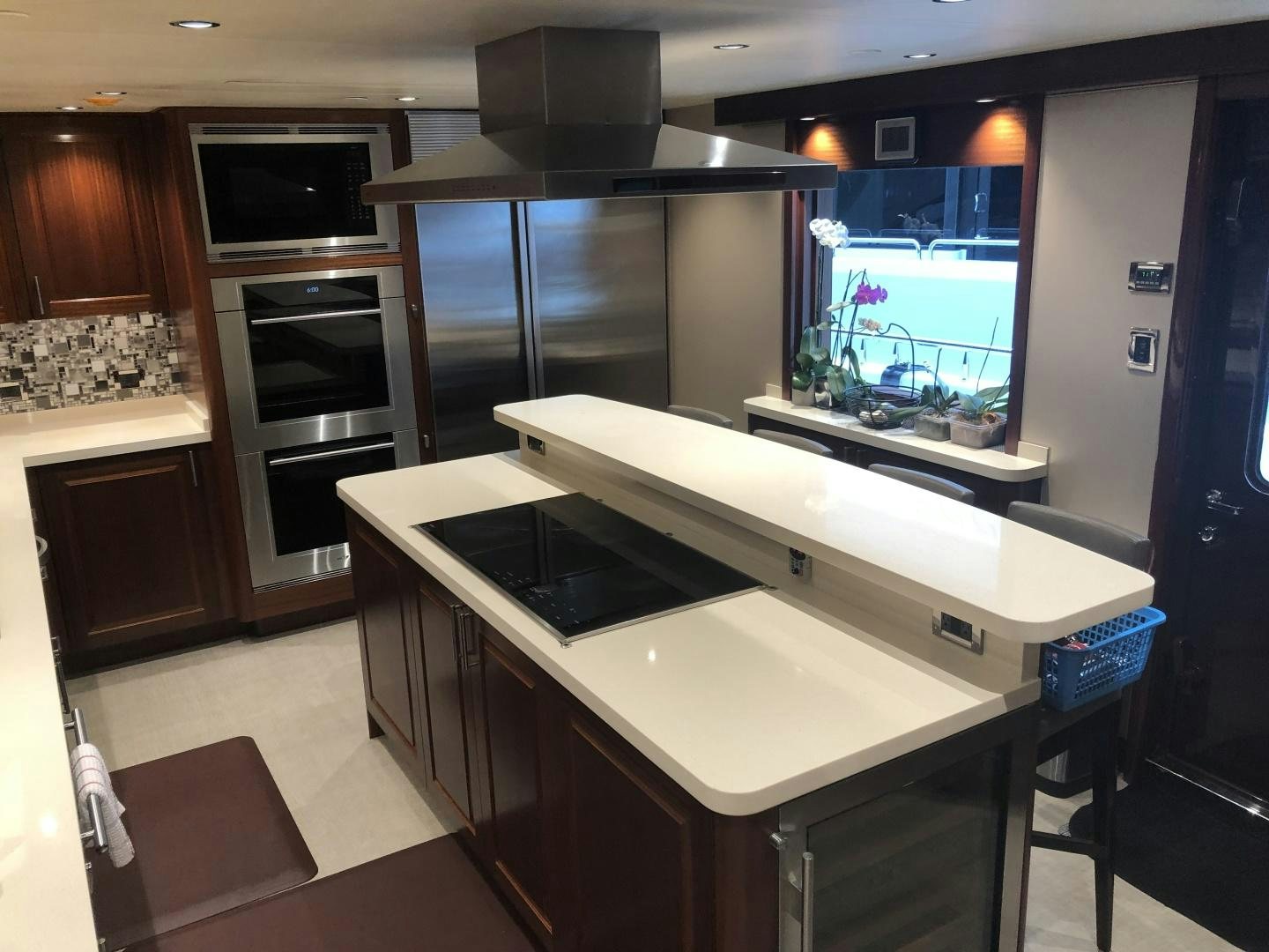 a kitchen with a large island aboard ARMS REACH Yacht for Sale