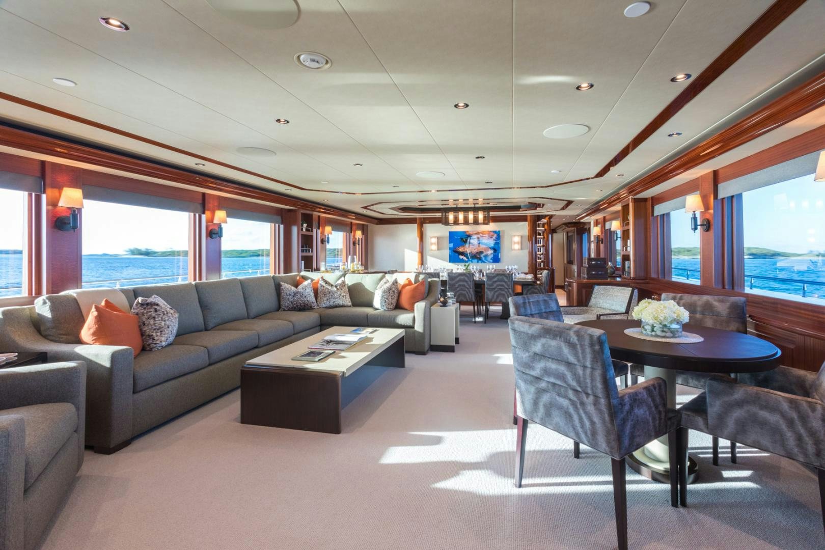 a living room with a couch and a table aboard ARMS REACH Yacht for Sale