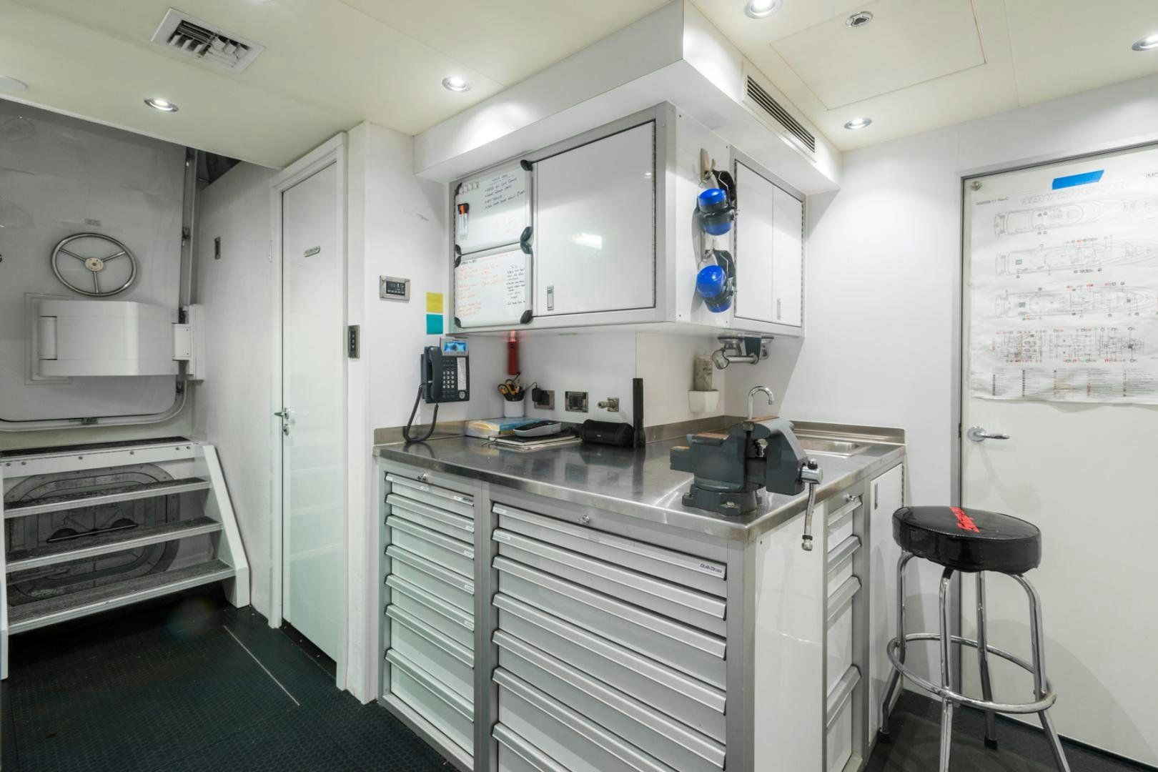 a kitchen with white cabinets aboard ARMS REACH Yacht for Sale