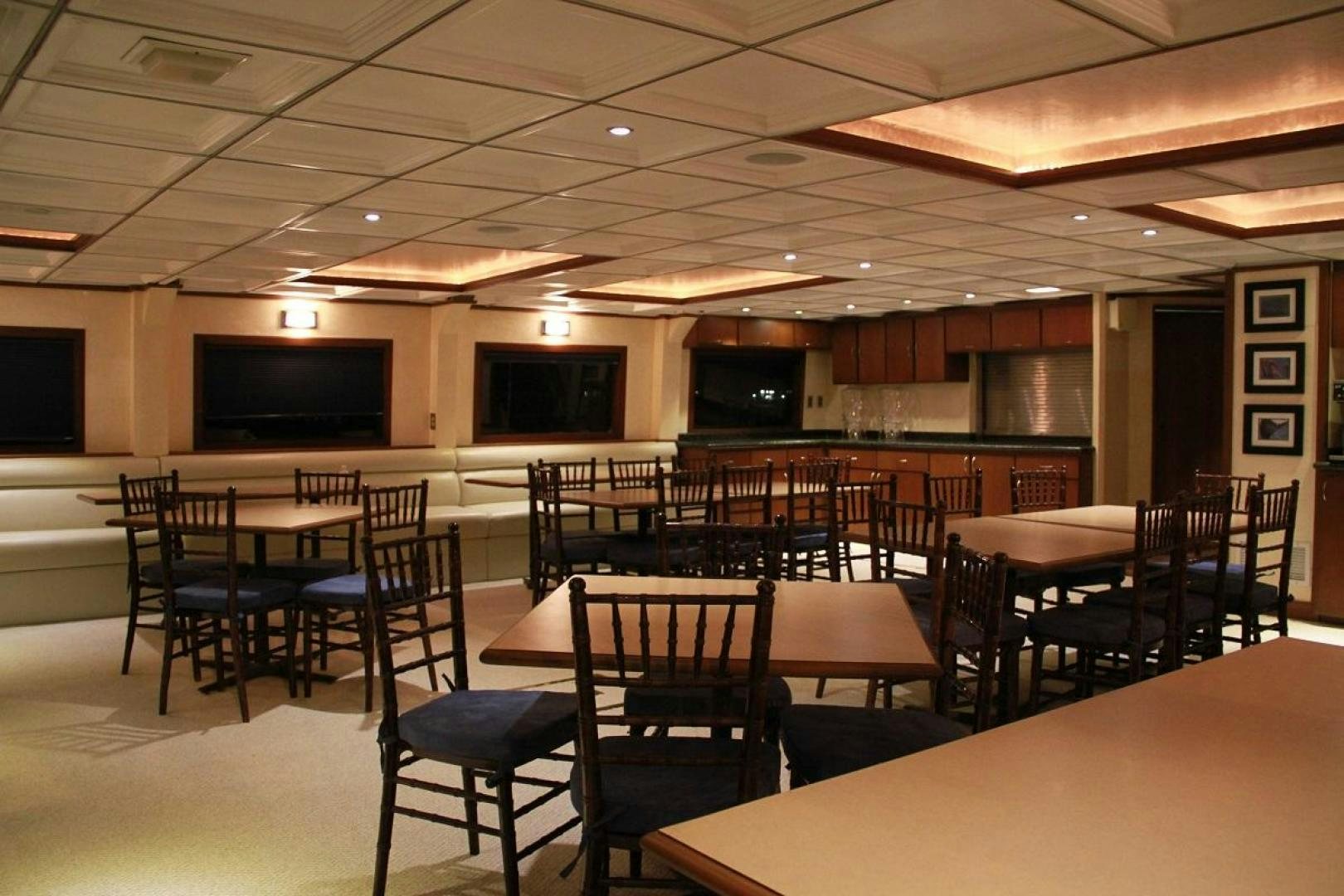 a room with tables and chairs aboard NO NAME Yacht for Sale