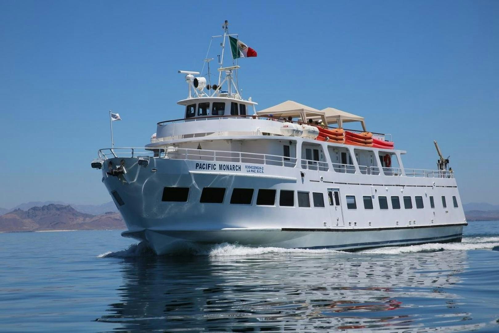a large white boat on the water aboard NO NAME Yacht for Sale