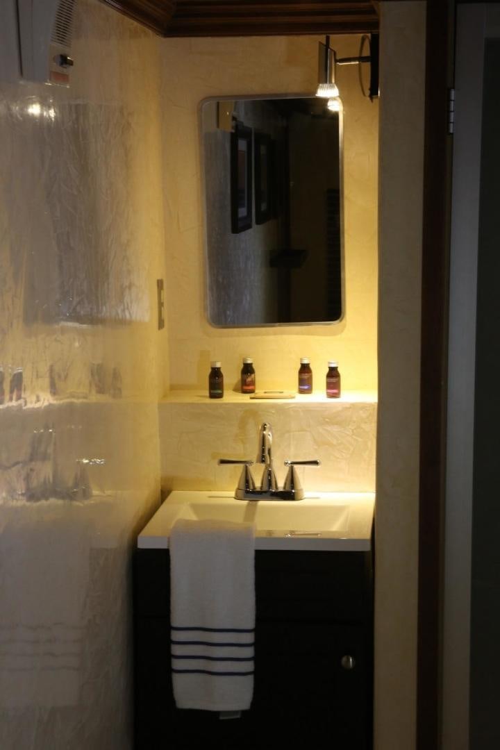 a bathroom with a mirror and a sink aboard NO NAME Yacht for Sale