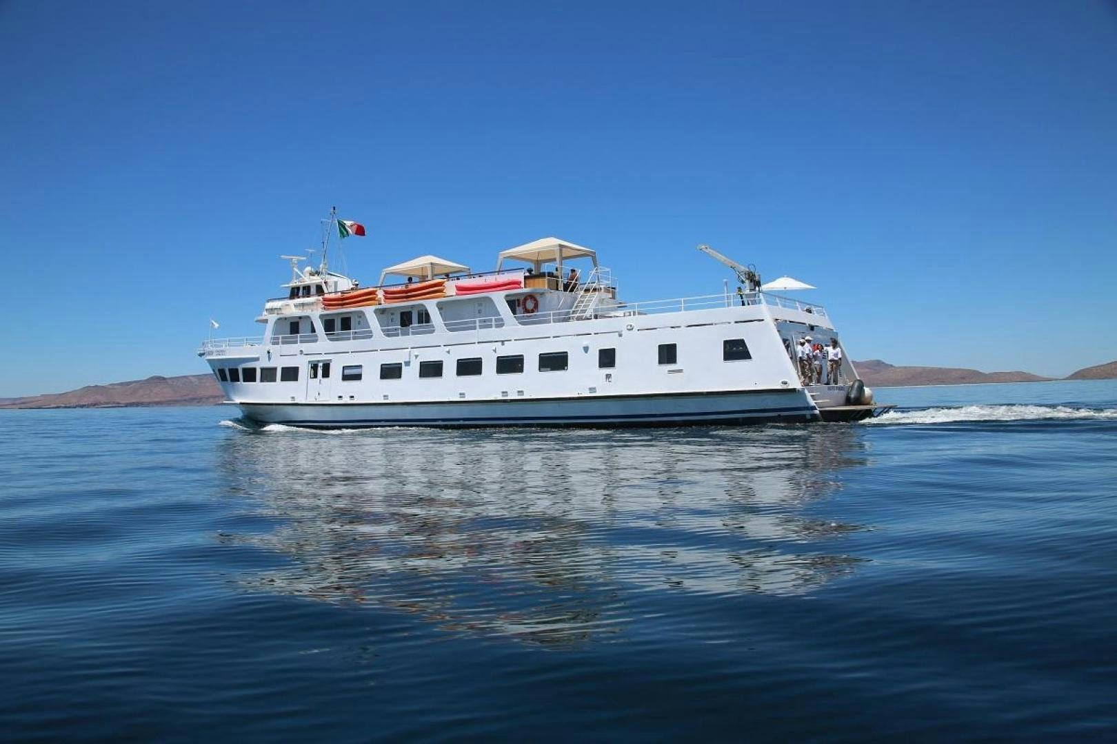 a white boat on water aboard NO NAME Yacht for Sale