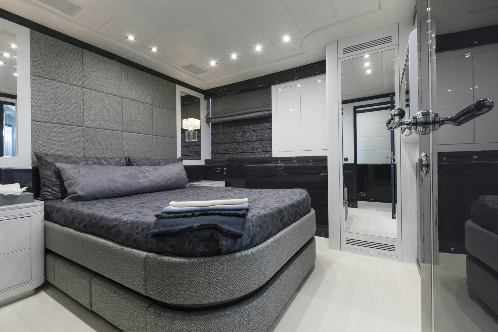 a large bedroom with a bed aboard VENI VIDI VICI Yacht for Sale