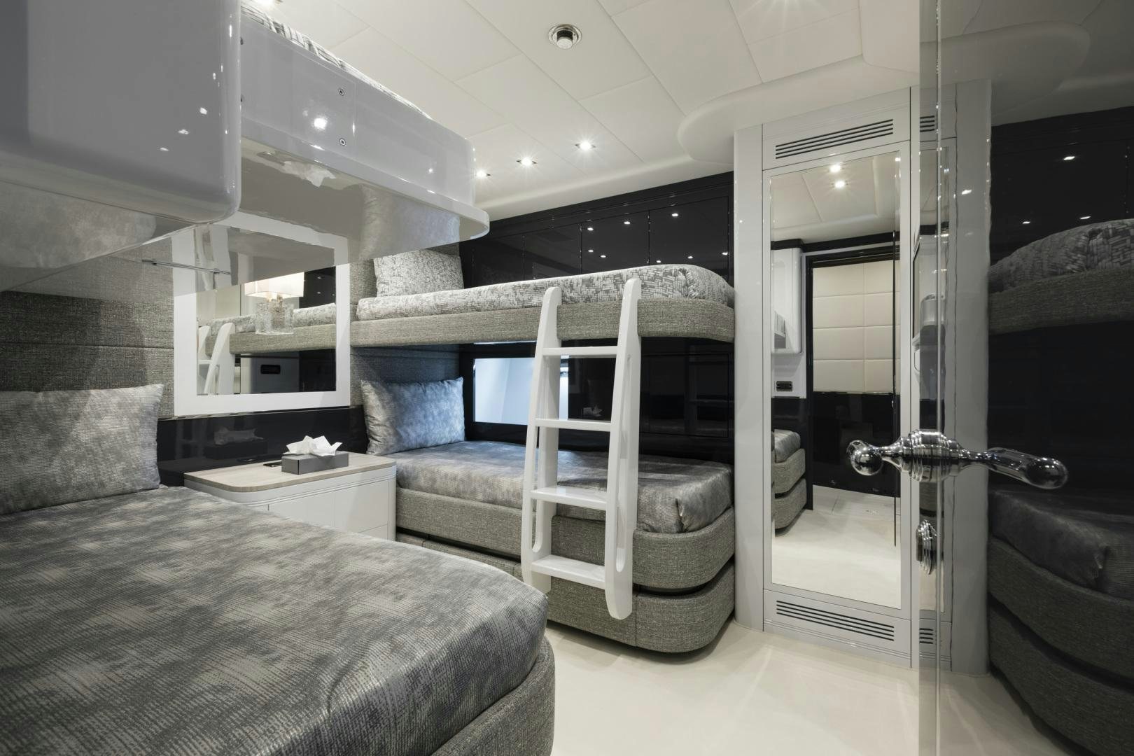 a bedroom with a bed and a desk aboard VENI VIDI VICI Yacht for Sale