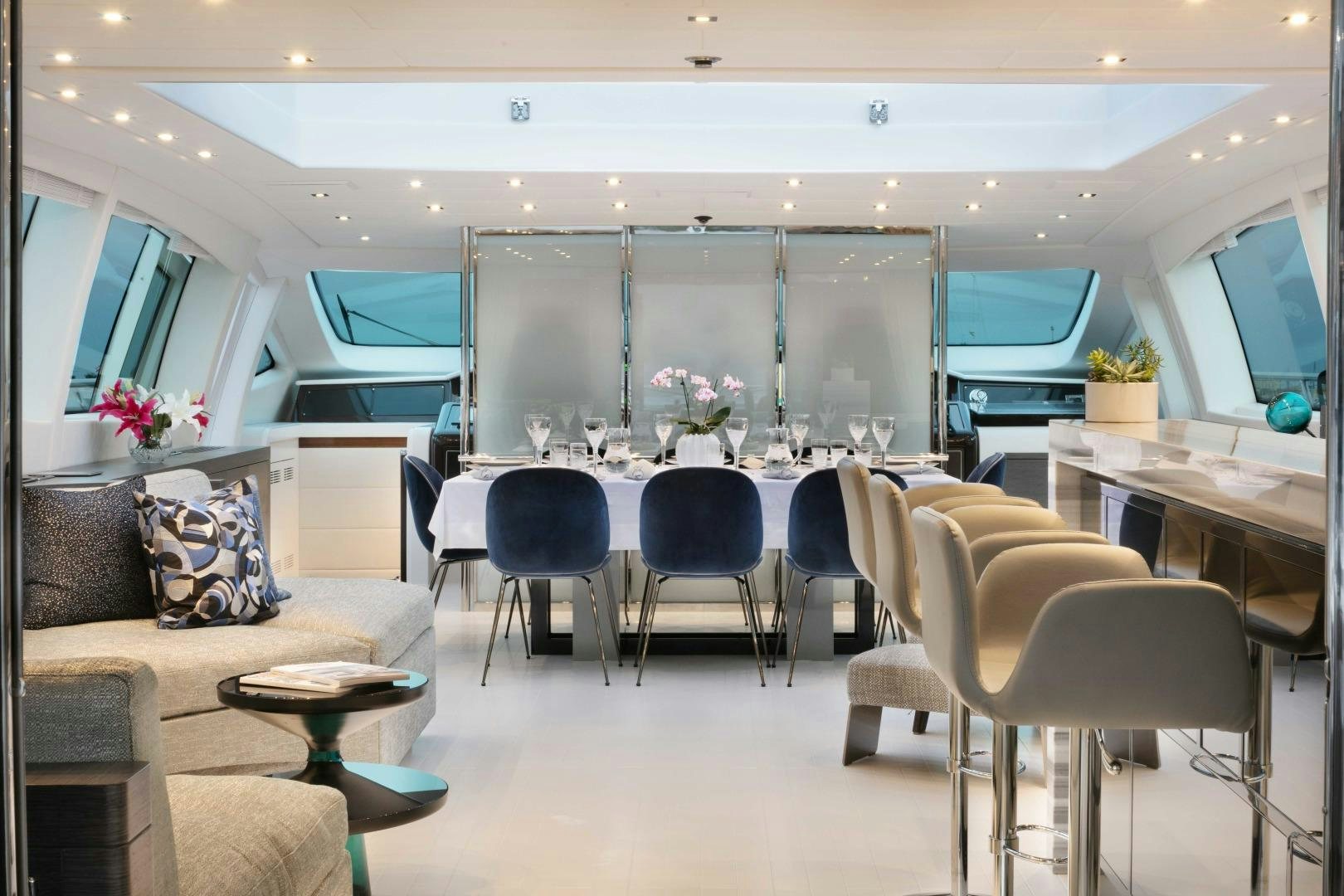 a room with a couch and chairs aboard VENI VIDI VICI Yacht for Sale