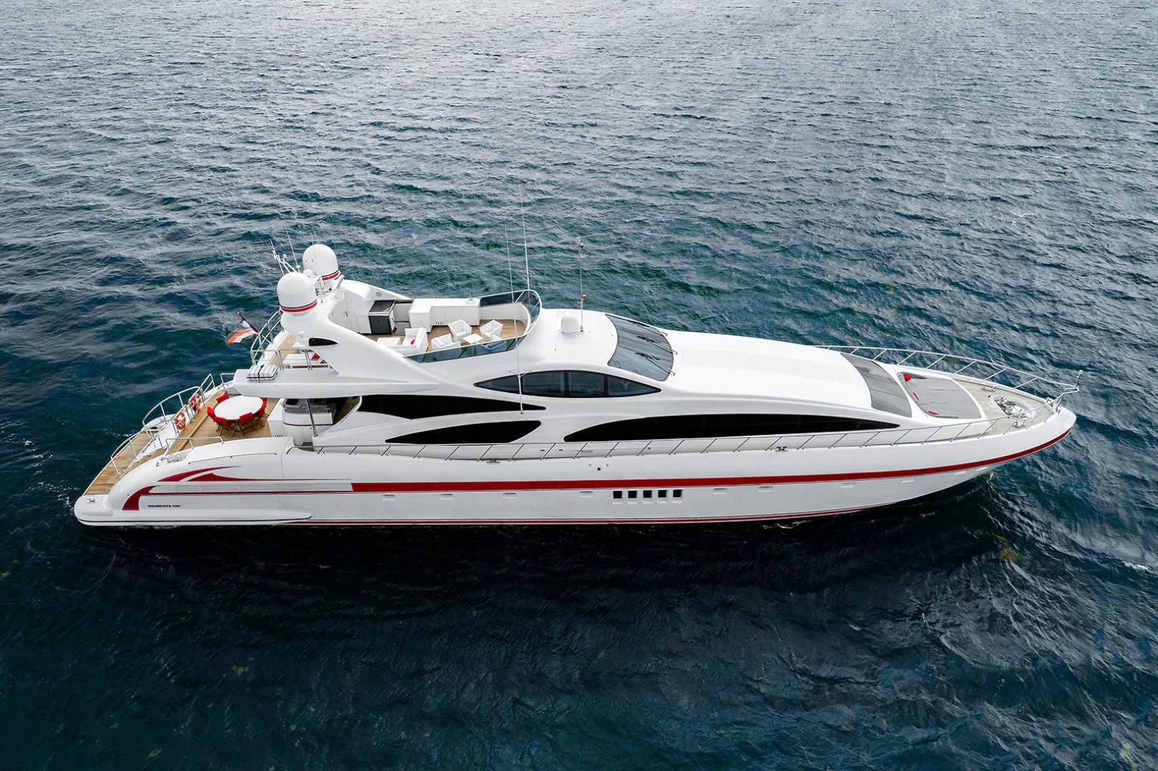 a white and red boat in the water aboard KABIR 130S STABILIZED WITHOUT TAKING AWAY FROM PERFORMANCE (COPY) Yacht for Sale