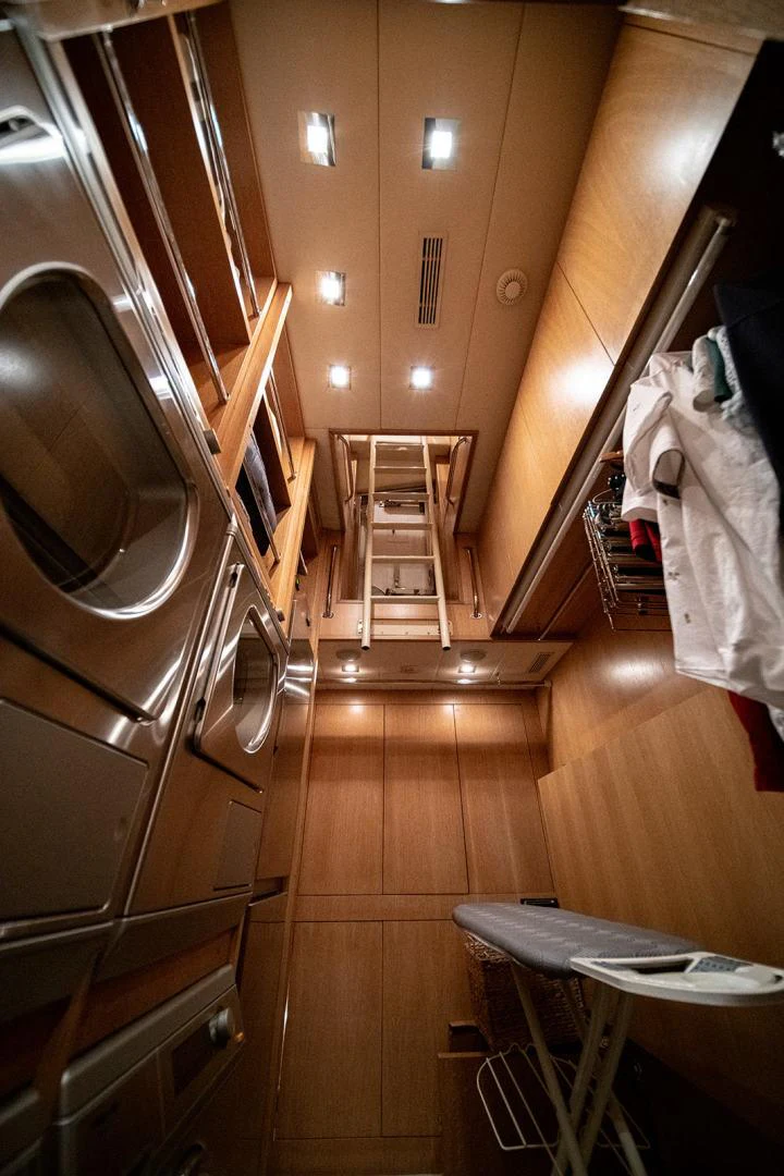 a room with a mirror and a table and a chair aboard KABIR 130S STABILIZED WITHOUT TAKING AWAY FROM PERFORMANCE (COPY) Yacht for Sale
