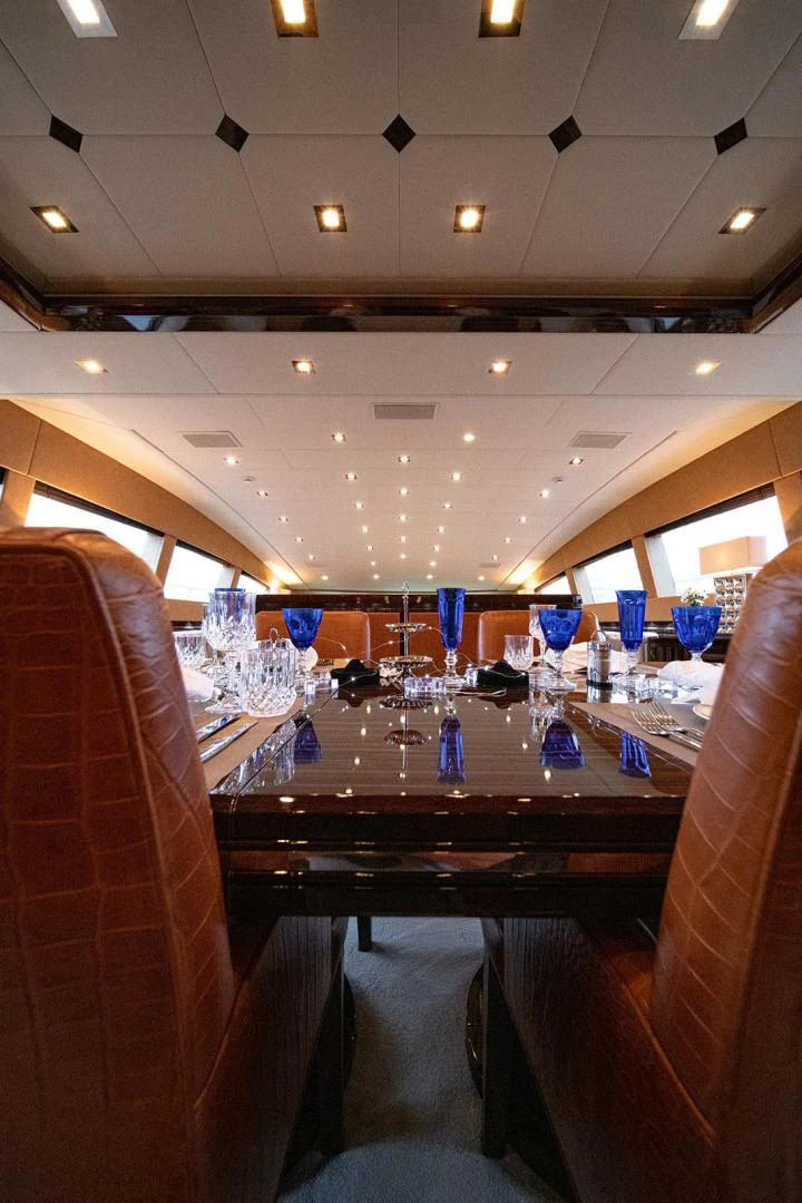 a bar with a table and chairs aboard KABIR 130S STABILIZED WITHOUT TAKING AWAY FROM PERFORMANCE (COPY) Yacht for Sale