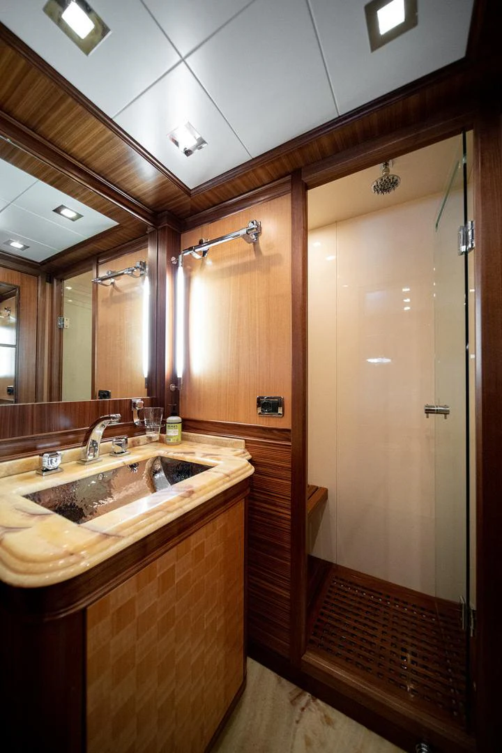 a bathroom with a sink and a shower aboard KABIR 130S STABILIZED WITHOUT TAKING AWAY FROM PERFORMANCE (COPY) Yacht for Sale