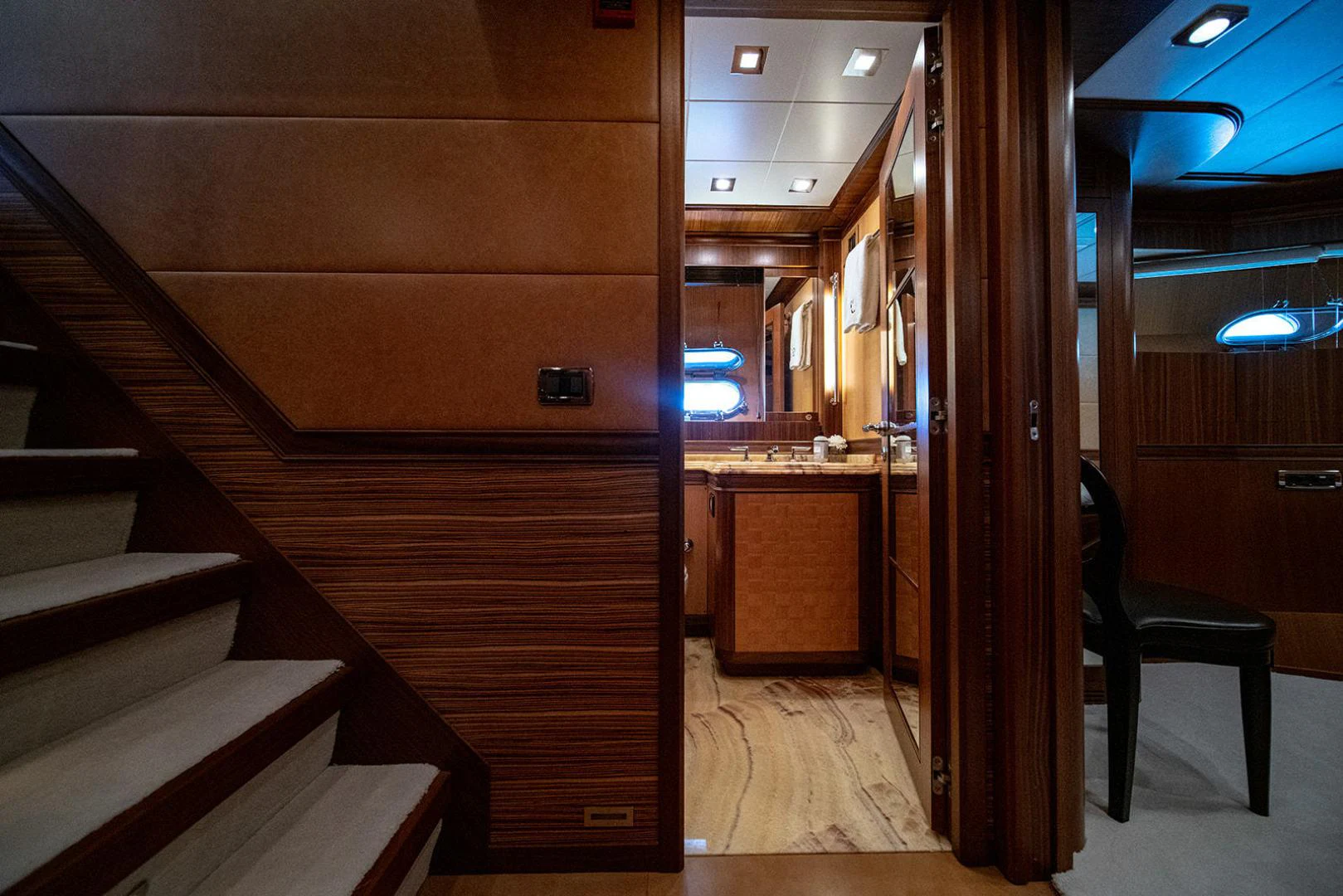 a room with wooden cabinets and a chair and a desk aboard KABIR 130S STABILIZED WITHOUT TAKING AWAY FROM PERFORMANCE (COPY) Yacht for Sale
