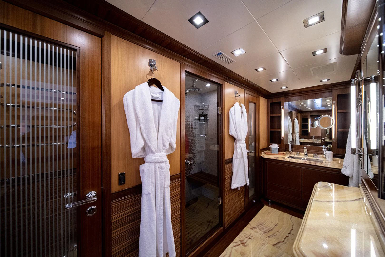 a large bathroom with a large mirror aboard KABIR 130S STABILIZED WITHOUT TAKING AWAY FROM PERFORMANCE (COPY) Yacht for Sale