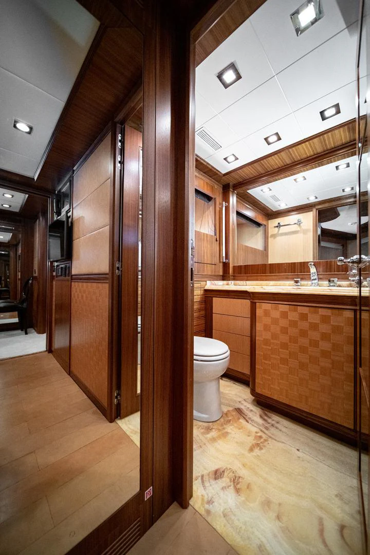 a bathroom with a wood floor aboard KABIR 130S STABILIZED WITHOUT TAKING AWAY FROM PERFORMANCE (COPY) Yacht for Sale