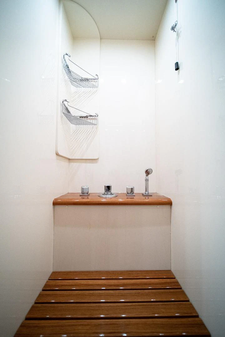 a wooden shelf with a light on it aboard KABIR 130S STABILIZED WITHOUT TAKING AWAY FROM PERFORMANCE (COPY) Yacht for Sale