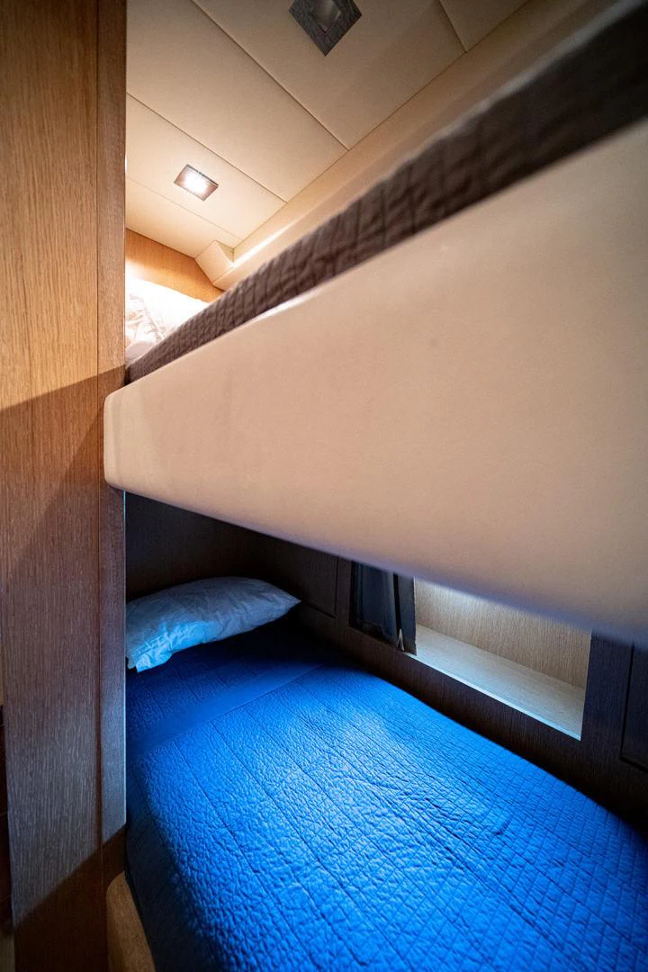 a bed with a white sheet aboard KABIR 130S STABILIZED WITHOUT TAKING AWAY FROM PERFORMANCE (COPY) Yacht for Sale