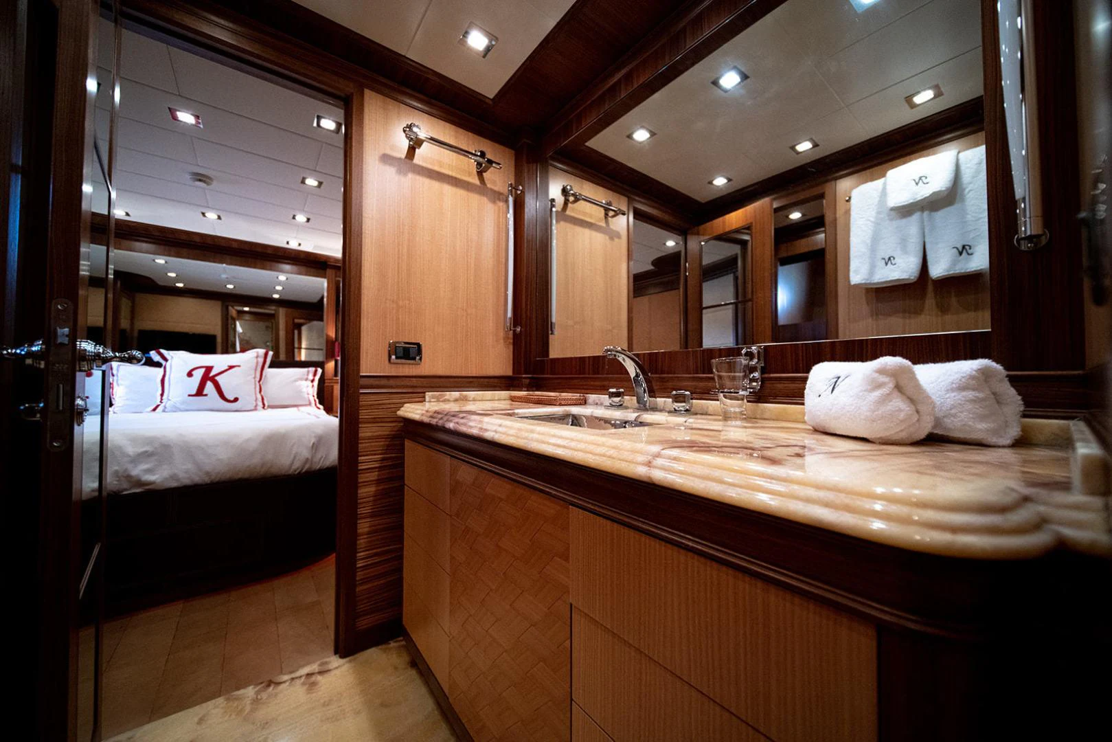 a bathroom with a large mirror aboard KABIR 130S STABILIZED WITHOUT TAKING AWAY FROM PERFORMANCE (COPY) Yacht for Sale