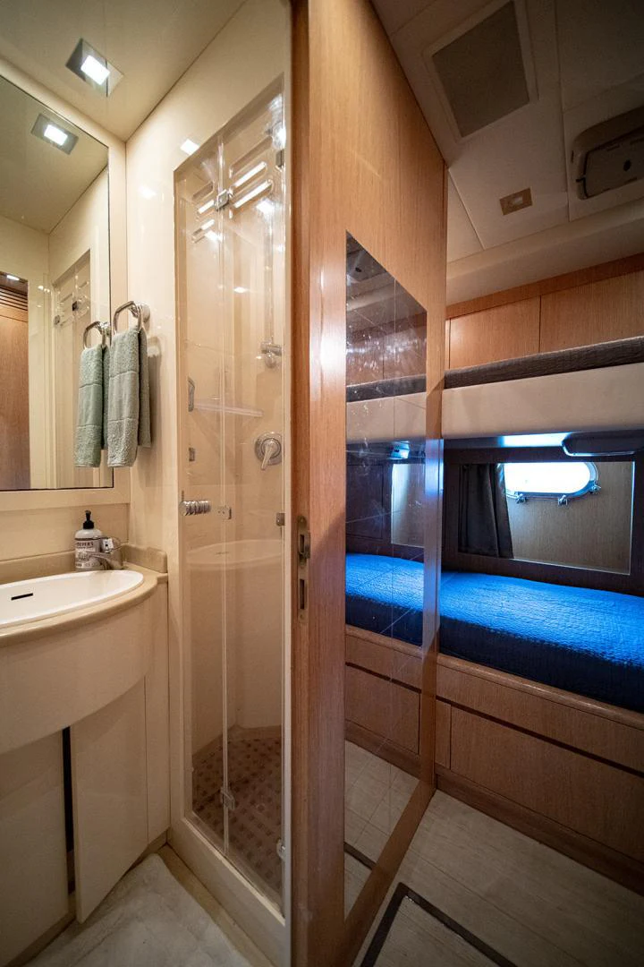 a bathroom with a glass shower aboard KABIR 130S STABILIZED WITHOUT TAKING AWAY FROM PERFORMANCE (COPY) Yacht for Sale
