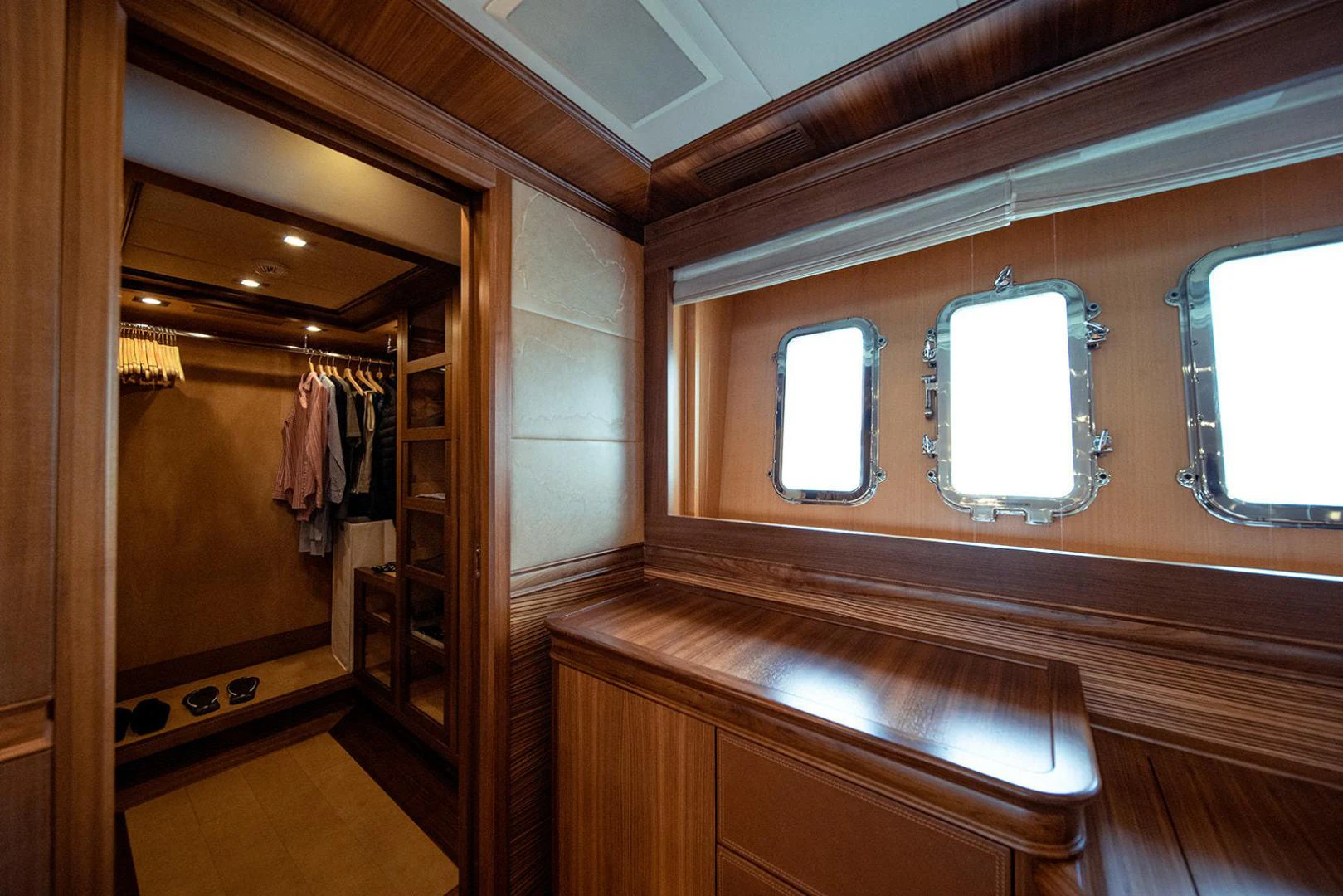 a bathroom with a large mirror aboard KABIR 130S STABILIZED WITHOUT TAKING AWAY FROM PERFORMANCE (COPY) Yacht for Sale